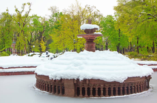 Fountain covered in snow