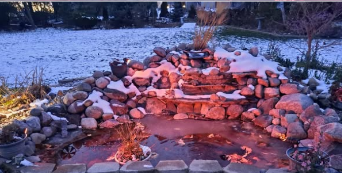 Pond and waterfall with snow and ice